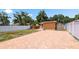 This backyard has a white vinyl fence, an enclosed hot tub, brick pavers and a storage shed at 5324 3Rd N Ave, St Petersburg, FL 33710
