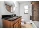 The bathroom features a stone countertop vanity and a fully tiled tub and shower enclosure at 5324 3Rd N Ave, St Petersburg, FL 33710