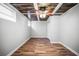 Bedroom featuring wood-like flooring, rustic ceiling and a ceiling fan with an attached light fixture at 5324 3Rd N Ave, St Petersburg, FL 33710