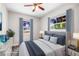 Bedroom featuring a comfortable bed, two windows, and neutral walls at 5324 3Rd N Ave, St Petersburg, FL 33710