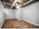 Bedroom featuring wood-like flooring, rustic ceiling and a ceiling fan with an attached light fixture at 5324 3Rd N Ave, St Petersburg, FL 33710