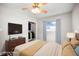 Comfortable bedroom with large window, dresser, closet, and ceiling fan at 5324 3Rd N Ave, St Petersburg, FL 33710