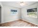 Bedroom with natural light from two windows and wood-look floors at 5324 3Rd N Ave, St Petersburg, FL 33710