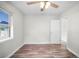 Bright bedroom with wood-look floors, ceiling fan and access to the house at 5324 3Rd N Ave, St Petersburg, FL 33710