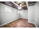 Spacious bedroom featuring unique ceiling detail, wood-look floors, and neutral paint at 5324 3Rd N Ave, St Petersburg, FL 33710