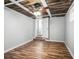 View of a bedroom with wood-look floors and an open door at 5324 3Rd N Ave, St Petersburg, FL 33710