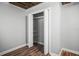 Empty closet showcasing wood-like flooring, shelves and a hanging rod at 5324 3Rd N Ave, St Petersburg, FL 33710