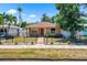 Charming home with mature landscaping, a fenced front yard, and a brick walkway at 5324 3Rd N Ave, St Petersburg, FL 33710