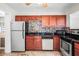 Kitchen with granite countertops, stainless steel appliances, and wooden cabinets at 5324 3Rd N Ave, St Petersburg, FL 33710