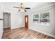 Welcoming living room boasting a ceiling fan, hardwood floors and a bright, sunny window at 5324 3Rd N Ave, St Petersburg, FL 33710