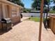 Outdoor patio area with grill, built-in shelves, and fenced yard at 5324 3Rd N Ave, St Petersburg, FL 33710