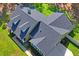 Aerial shot showcasing the roof of the property and well-manicured landscaping at 5458 Zamia Dr, Brooksville, FL 34604