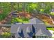 Aerial view of the property featuring a lush backyard, mature trees, and a private home at 5458 Zamia Dr, Brooksville, FL 34604
