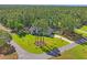 Stunning aerial view of a home with pristine lawn, mature trees, and a peaceful setting at 5458 Zamia Dr, Brooksville, FL 34604