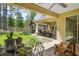 Relaxing backyard with a covered patio, fireplace and well manicured lawn at 5458 Zamia Dr, Brooksville, FL 34604