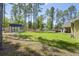 Spacious backyard with a shed and covered patio with hot tub that is perfect for outdoor entertaining at 5458 Zamia Dr, Brooksville, FL 34604
