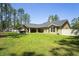 Spacious backyard with a covered patio, hot tub and plenty of room to play and relax in at 5458 Zamia Dr, Brooksville, FL 34604