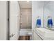 Clean bathroom featuring a shower and bath combo, plus stylish sink and granite counters at 5458 Zamia Dr, Brooksville, FL 34604