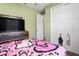 Cozy, playful bedroom featuring a Hello Kitty bedspread and ceiling fan at 5458 Zamia Dr, Brooksville, FL 34604