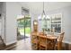 Dining room with backyard views and natural light from sliding glass doors and windows at 5458 Zamia Dr, Brooksville, FL 34604