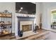 Cozy fireplace featuring a granite surround, mantle, and adjacent furniture perfect for decor at 5458 Zamia Dr, Brooksville, FL 34604