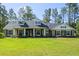Charming home featuring a well-manicured lawn, classic architectural details, and inviting curb appeal at 5458 Zamia Dr, Brooksville, FL 34604
