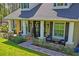 Inviting front porch with a welcoming entrance and decorative columns and exterior seating at 5458 Zamia Dr, Brooksville, FL 34604