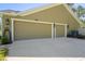 A wide shot of the three-car garage offering plenty of room for parking and storage at 5458 Zamia Dr, Brooksville, FL 34604