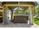 Hot tub inside covered pavilion with seating area in a spacious backyard that is great for entertaining at 5458 Zamia Dr, Brooksville, FL 34604