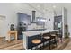 Eat-in kitchen with a large island, stainless appliances, breakfast bar, and open floorplan at 5458 Zamia Dr, Brooksville, FL 34604