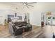 Bright living room featuring an open-concept design with hardwood floors and comfortable seating at 5458 Zamia Dr, Brooksville, FL 34604