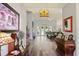 Bright living room featuring a fireplace, hardwood floors, and a large, comfortable sofa at 5458 Zamia Dr, Brooksville, FL 34604