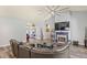 Spacious living room featuring hardwood floors, a fireplace, and plenty of natural light at 5458 Zamia Dr, Brooksville, FL 34604