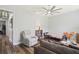 Inviting living room with hardwood floors and a large window offers ample seating and natural light at 5458 Zamia Dr, Brooksville, FL 34604
