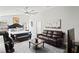 Spacious main bedroom featuring a sitting area, a ceiling fan, and elegant decor at 5458 Zamia Dr, Brooksville, FL 34604