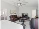 This spacious main bedroom features a comfortable seating area and an ensuite bathroom at 5458 Zamia Dr, Brooksville, FL 34604