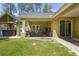 Inviting outdoor patio with a hot tub and seating area that is great for entertaining or relaxation at 5458 Zamia Dr, Brooksville, FL 34604