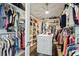 Spacious walk-in closet with custom shelving and ample hanging space for clothes and accessories at 5458 Zamia Dr, Brooksville, FL 34604