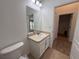 Bathroom featuring a single sink vanity, tile floor, and bright lighting at 5527 Kinglethill Dr, Lithia, FL 33547