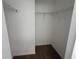 Walk-in closet features white walls, neutral carpet, and wire shelving at 5527 Kinglethill Dr, Lithia, FL 33547