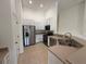 Bright kitchen featuring stainless steel appliances and white cabinetry at 5527 Kinglethill Dr, Lithia, FL 33547