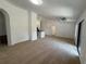 Spacious living room with neutral carpet and access to kitchen, offering a comfortable and versatile space at 5527 Kinglethill Dr, Lithia, FL 33547
