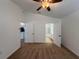 Main bedroom with neutral carpet and access to the ensuite bathroom, creating a private retreat at 5527 Kinglethill Dr, Lithia, FL 33547