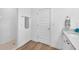 Modern bathroom with tiled shower, vanity, and stylish fixtures at 5539 Silver Sun Dr, Apollo Beach, FL 33572