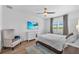 Bright bedroom with a comfortable bed, neutral decor, and tranquil lake view at 5539 Silver Sun Dr, Apollo Beach, FL 33572