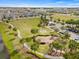 Aerial view of a new community park with lush greenery, walking trails, playground, and ample parking at 5539 Silver Sun Dr, Apollo Beach, FL 33572