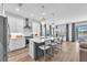 Bright kitchen features a large island, stainless steel appliances, and elegant pendant lighting at 5539 Silver Sun Dr, Apollo Beach, FL 33572