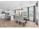 Modern kitchen with stainless steel appliances, island seating, and elegant chandelier at 5539 Silver Sun Dr, Apollo Beach, FL 33572
