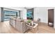 Comfortable living room with a sleek fireplace, lake views, and a stylish decor at 5539 Silver Sun Dr, Apollo Beach, FL 33572