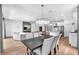 Open-concept living space with modern lighting and comfortable seating at 5539 Silver Sun Dr, Apollo Beach, FL 33572